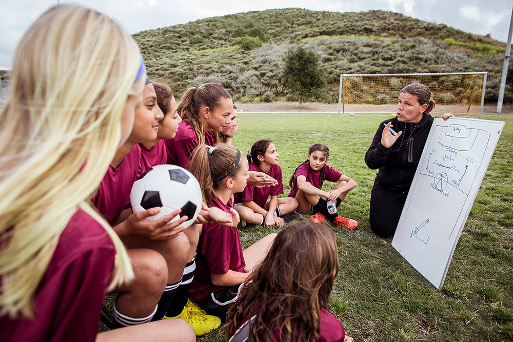 Youth Sports Coach Talking to Students