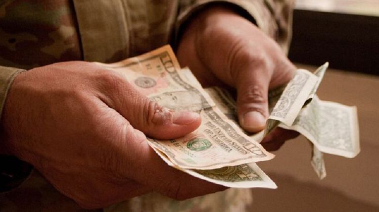 Soldier counting money