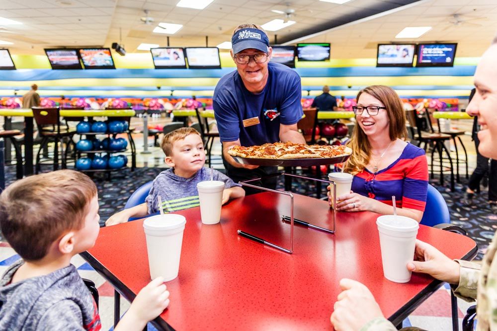 Pizza being served at bowling center